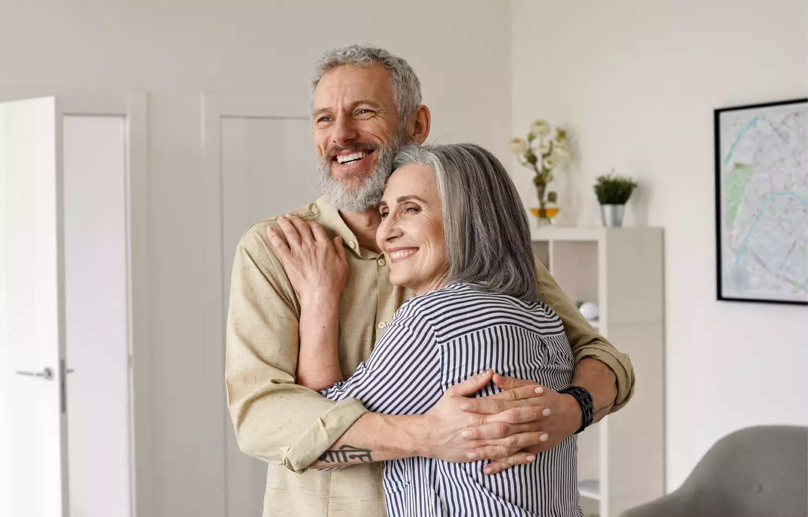 elderly couple hugging