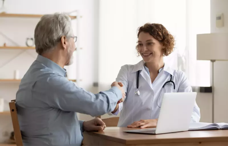 doctor shaking hands with patient