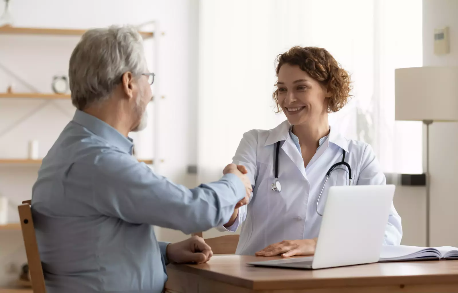 doctor shaking hands with patient