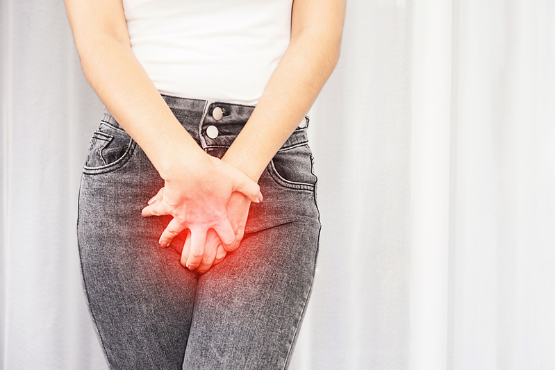 woman holding her bladder